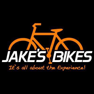 Logo featuring an orange outline of a bicycle with "JAKE’S BIKES" cleverly integrated into the frame, and the tagline "It's all about the Experience!" underneath—making Jake's Bikes stand out against a sleek black background.