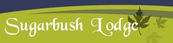 Sugarbush Lodge logo features white, stylized text set on a green background with a maple leaf graphic and a dark curved accent at the top, perfectly reflecting the charm of Sugarbush Lodge.