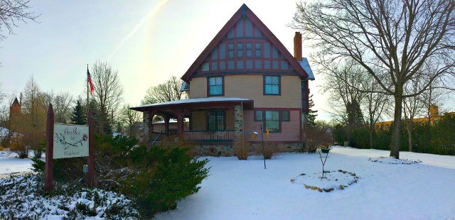 The outside still retains its original structure with oversized gables and diamond paned windows.
