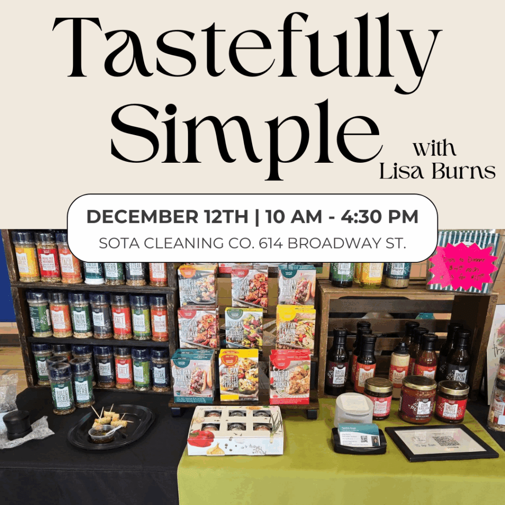 A Tastefully Simple Pop Up display table features products, samples, and flyers in front of shelves. Text reads: "Tastefully Simple with Lisa Burns. December 12th | 10 AM - 4:30 PM. SOTA Cleaning Co. 614 Broadway St.